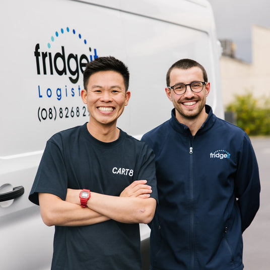 Ethan Tan and Lewis Evangelou, in front of a Fridge It delivery van