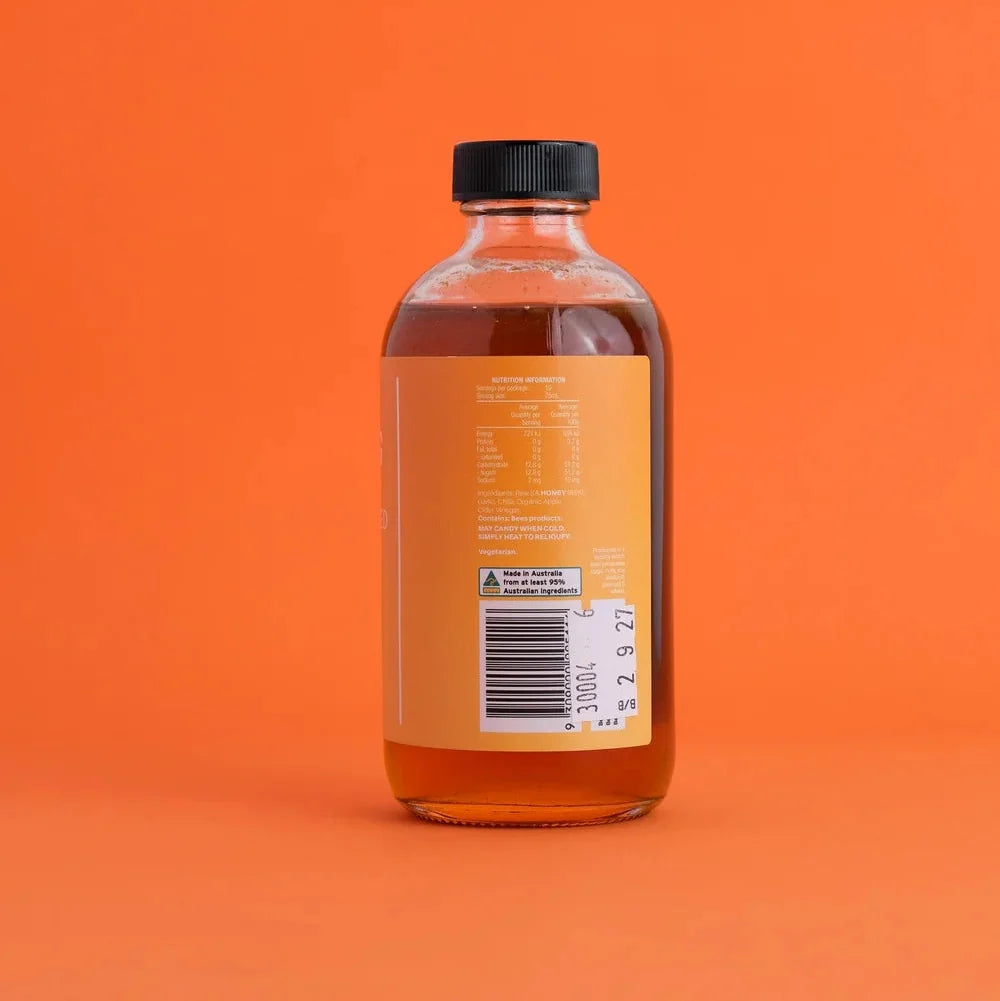A 250ml glass bottle of Salt Gang Hot Fermented Honey