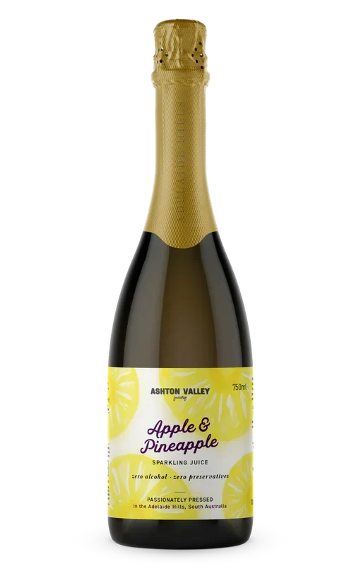 A 750ml glass bottle of Ashton Valley Juicery Apple and Pineapple sparkling juice