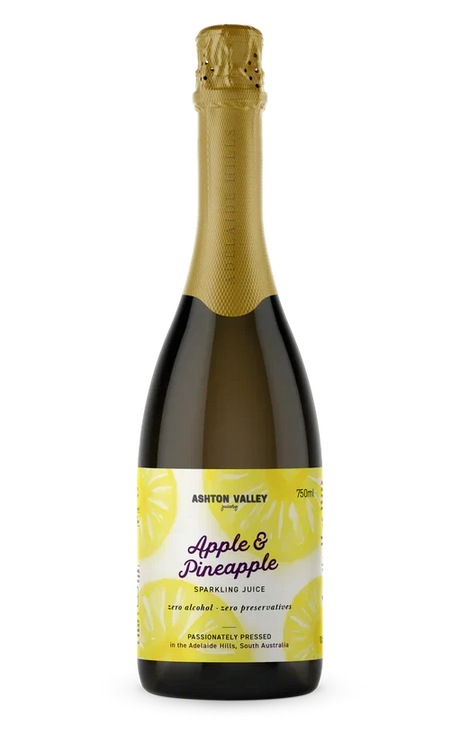 A 750ml glass bottle of Ashton Valley Juicery Apple and Pineapple sparkling juice