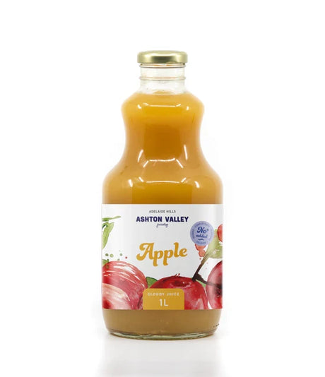 A 1L glass of Ashton Valley Juicery still cloudy apple juice