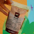 A 125g pouch of din-a-dun Red Wine Jus