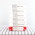 A stack of packaged meals from Dinner King on a table