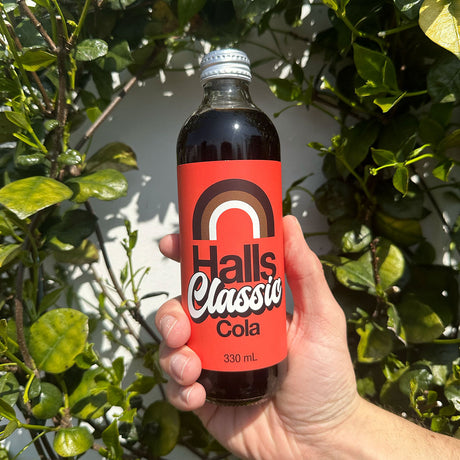 A 330ml glass bottle of Halls Classic Cola