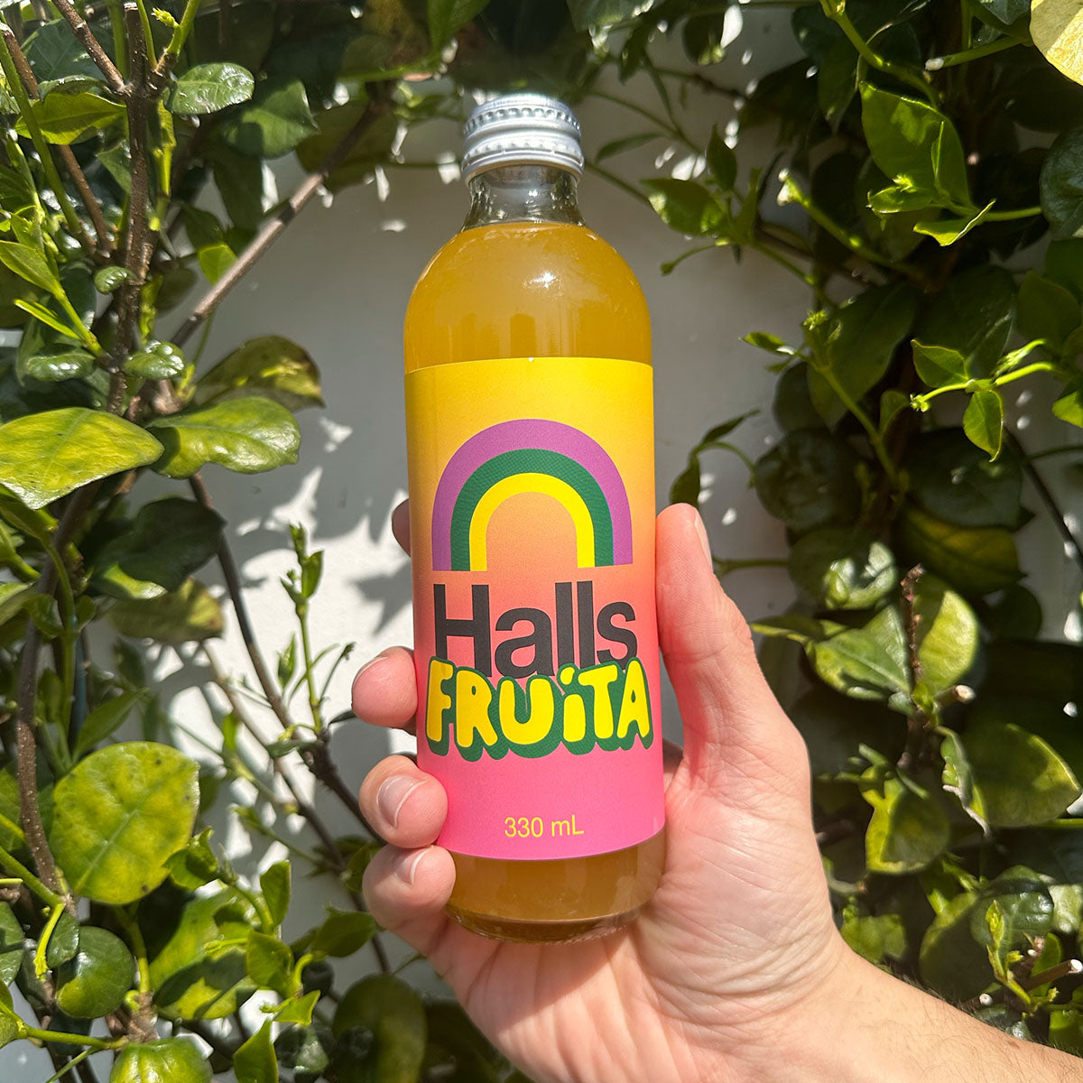 A 330ml glass bottle of Halls Fruita