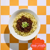 Bowl of ramen with green onions on a checkered orange and white background, featuring the Nourish Little Lives logo.