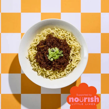 Bowl of ramen with green onions on a checkered orange and white background, featuring the Nourish Little Lives logo.