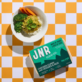 JNR Food Co. chicken curry with vegetables and rice on a checkered tablecloth