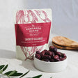 A 185g serve of Kangaroo Island Olives Smoked Kalamata Olives