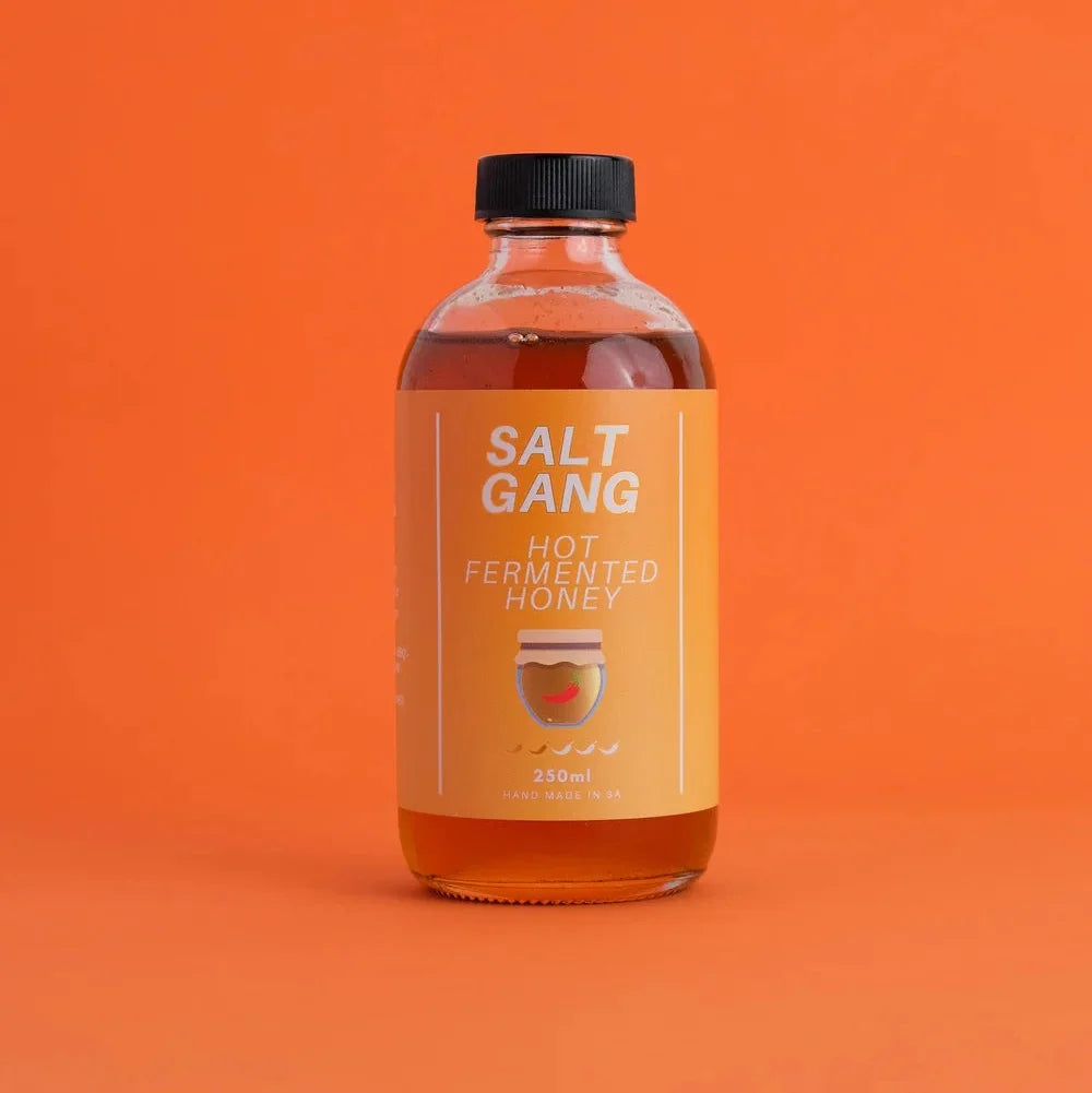 A 250ml glass bottle of Salt Gang Hot Fermented Honey